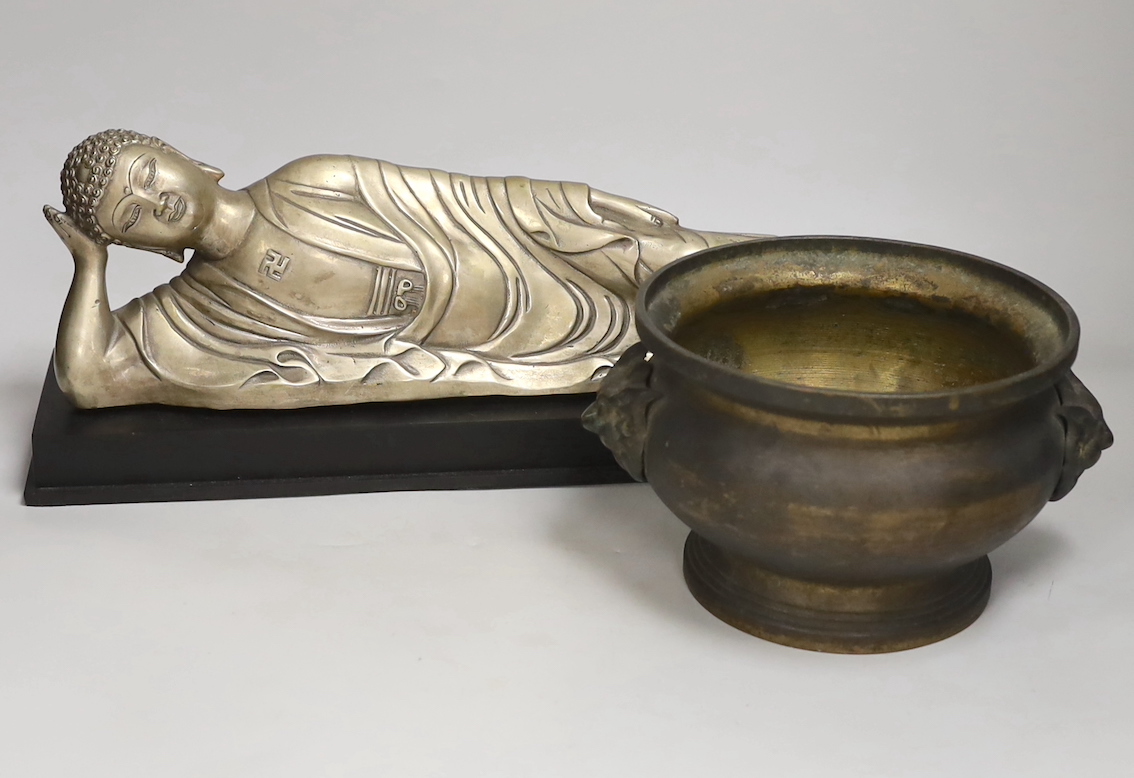 A Chinese silvered metal reclining Buddha and a two handled censer, reclining Buddha 41cm wide